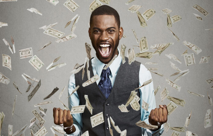 happy man celebrates raise