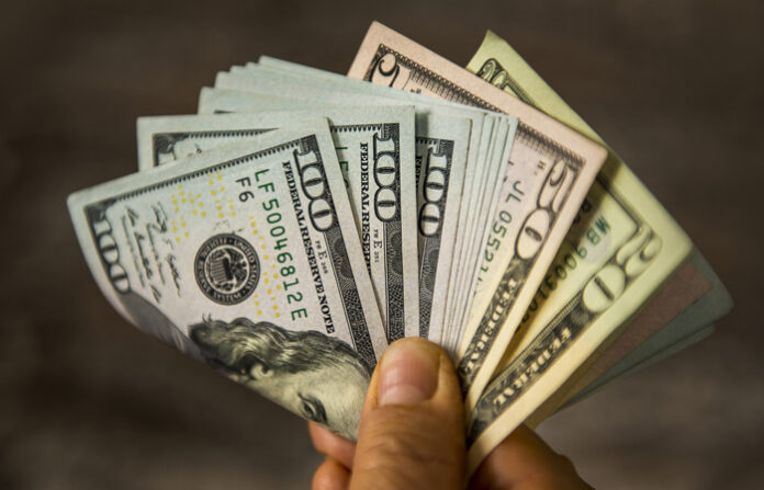 Holding fanned out bills to represent upgrade performance-management programs and pay-for-performance programs