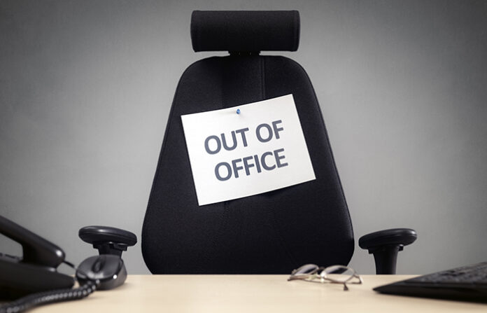An out of office sign illustrates mandatory time off from work