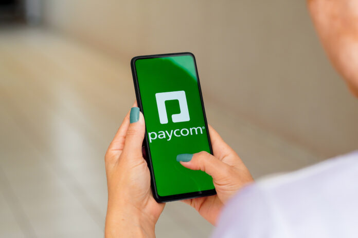 Paycom logo on phone